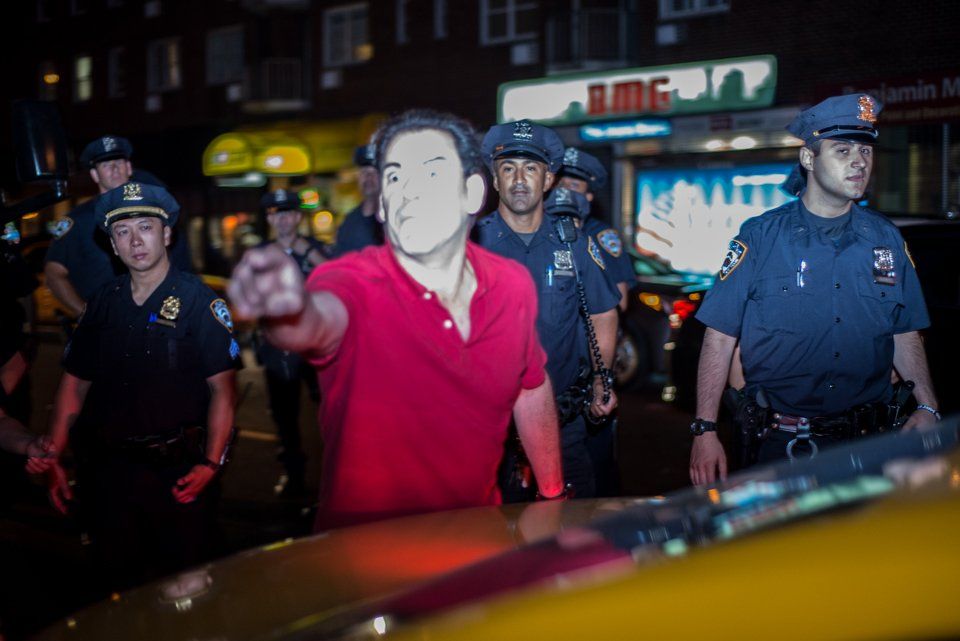 This man reportedly had to be held back by cops after he charged at protestors.</br>